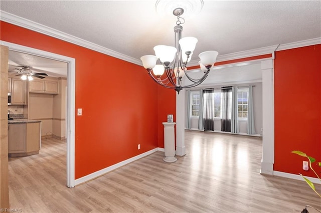 unfurnished dining area featuring ceiling fan with notable chandelier, light hardwood / wood-style floors, and ornamental molding