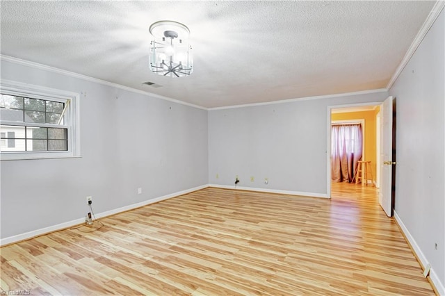 unfurnished room with light wood-type flooring, an inviting chandelier, and ornamental molding