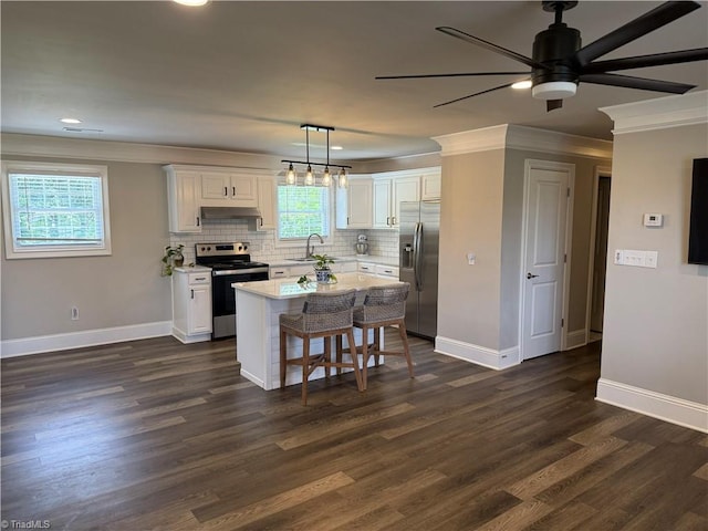 6472 S NC Highway 801 S, Mocksville, NC 27028 - kitchen featuring appliances with stainless steel finishes, ventilation hood, a ceiling fan, crown molding, and white cabinets