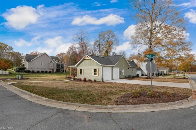 single story home featuring a front yard and a garage