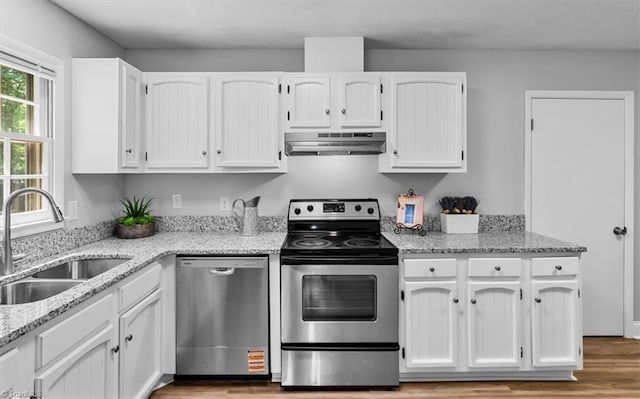 4 Manard Ct, Greensboro, NC 27407 - kitchen featuring stainless steel appliances, under cabinet range hood, a sink, and white cabinets