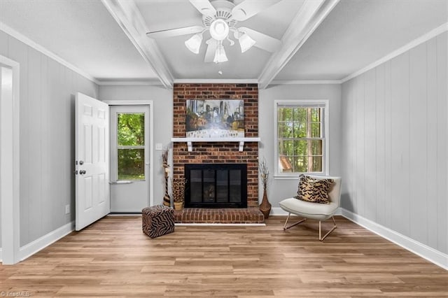 4 Manard Ct, Greensboro, NC 27407 - living area with wood finished floors, beam ceiling, crown molding, a brick fireplace, and ceiling fan