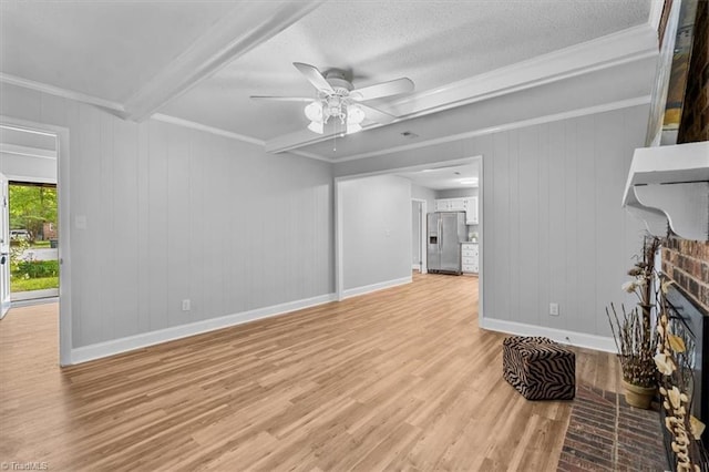 4 Manard Ct, Greensboro, NC 27407 - unfurnished living room with light wood-type flooring, crown molding, a ceiling fan, baseboards, and beamed ceiling