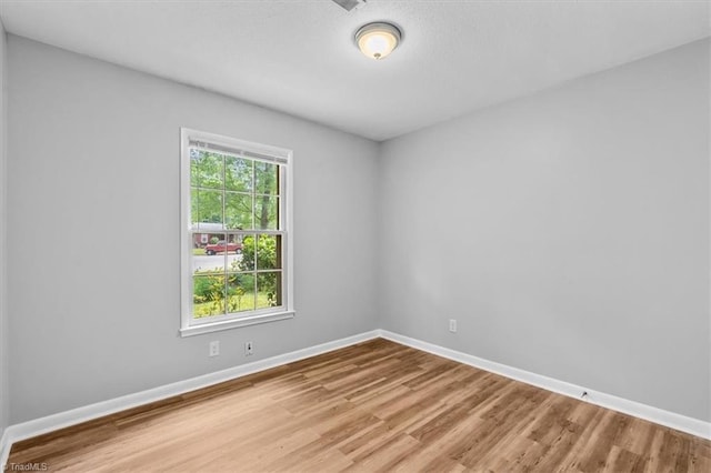 4 Manard Ct, Greensboro, NC 27407 - unfurnished room featuring wood finished floors and baseboards