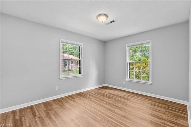 4 Manard Ct, Greensboro, NC 27407 - unfurnished room featuring light wood-type flooring and baseboards