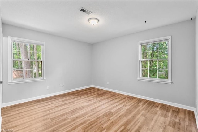 4 Manard Ct, Greensboro, NC 27407 - unfurnished room featuring healthy amount of natural light and baseboards