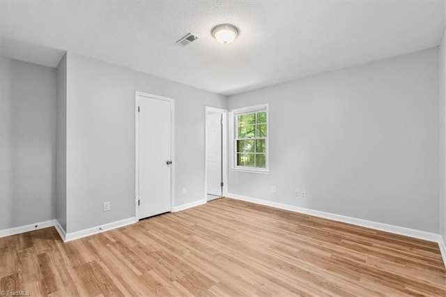 4 Manard Ct, Greensboro, NC 27407 - unfurnished bedroom with light wood-type flooring and baseboards