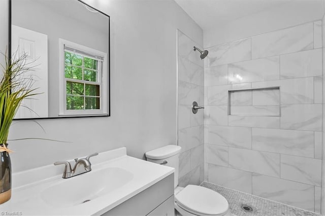 4 Manard Ct, Greensboro, NC 27407 - bathroom with vanity, toilet, and a tile shower