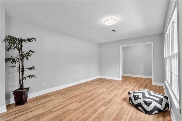 4 Manard Ct, Greensboro, NC 27407 - empty room with light wood finished floors and baseboards