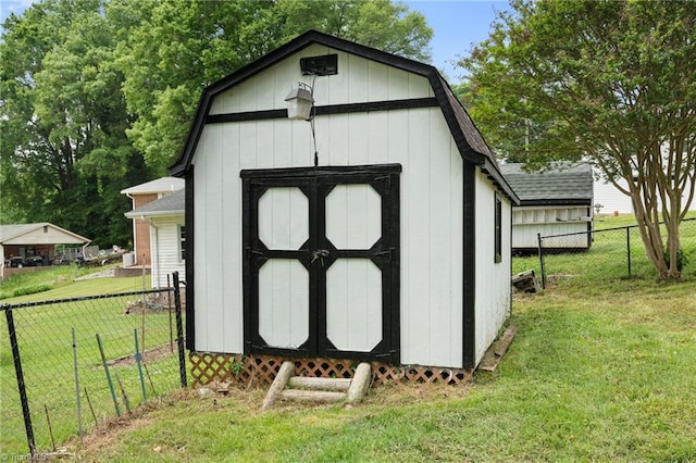 view of shed featuring fence