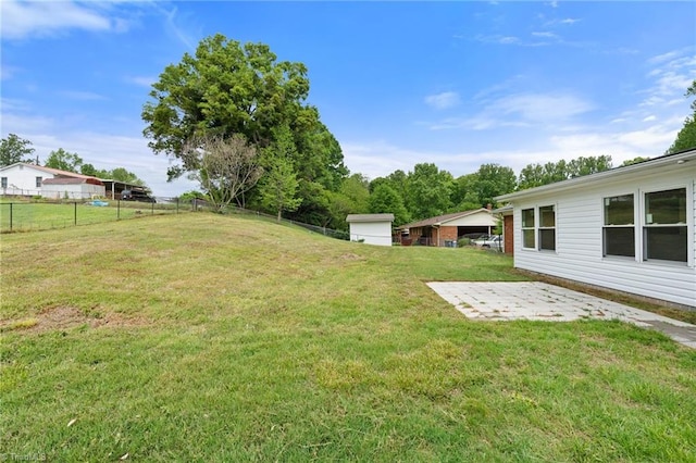 view of yard with a patio and fence