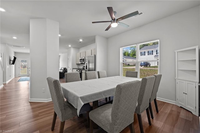 dining room featuring baseboards, recessed lighting, a ceiling fan, and wood finished floors