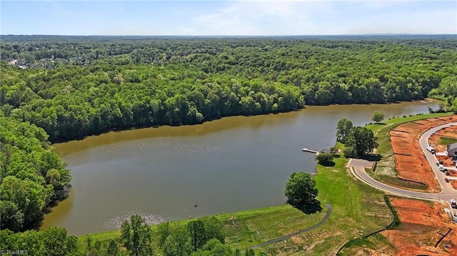 aerial view featuring a water view and a forest view
