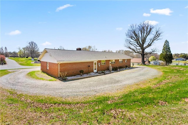 view of property exterior with a lawn