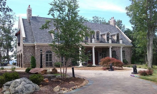 view of front of house featuring a balcony