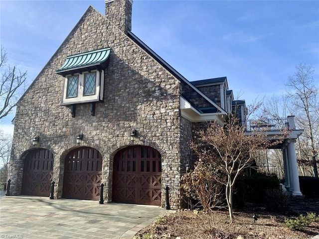 view of property exterior featuring a garage