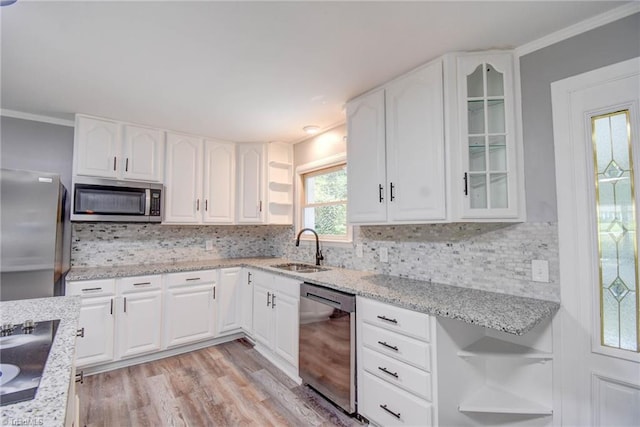 3422 Greenhill Dr, High Point, NC 27265 - kitchen featuring a sink, light stone countertops, appliances with stainless steel finishes, glass insert cabinets, and decorative backsplash