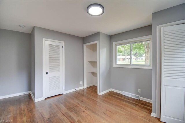 unfurnished bedroom with light hardwood / wood-style flooring