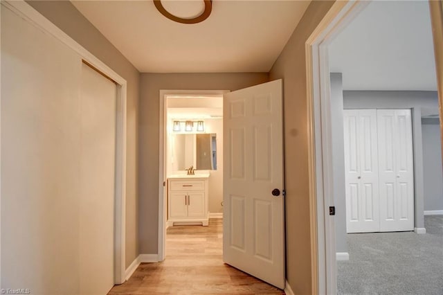 3422 Greenhill Dr, High Point, NC 27265 - hallway with baseboards and light wood-style floors