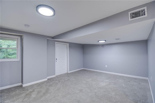 3422 Greenhill Dr, High Point, NC 27265 - below grade area with baseboards, visible vents, and carpet floors
