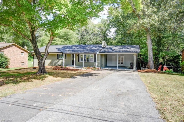 3422 Greenhill Dr, High Point, NC 27265 - single story home with an attached carport, aphalt driveway, and a chimney