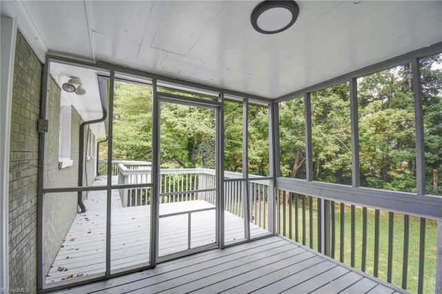 unfurnished sunroom with plenty of natural light