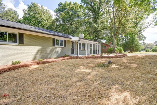 exterior space with a sunroom