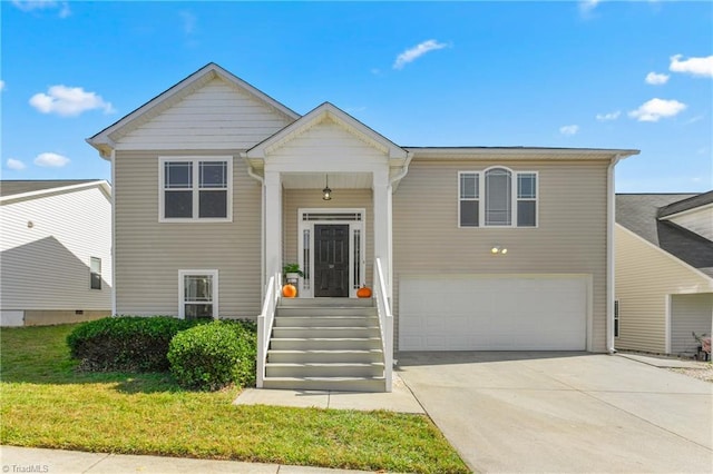 split foyer home with a garage and a front lawn