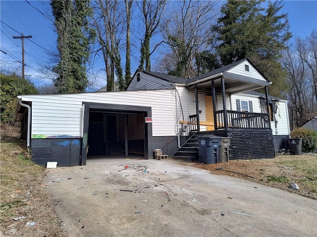 exterior space with a garage and a porch