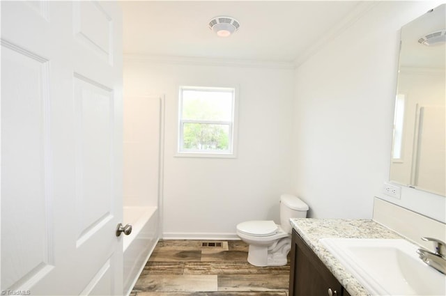 572 Kirby Bowman Rd, Siloam, NC 27047 - full bath featuring vanity, ornamental molding, wood finished floors, toilet, and baseboards