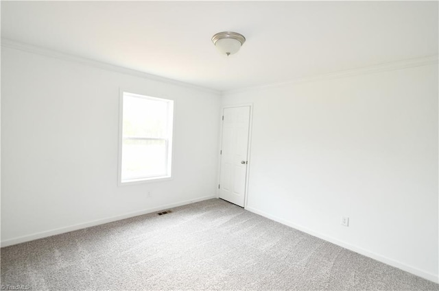 572 Kirby Bowman Rd, Siloam, NC 27047 - spare room with crown molding, carpet floors, and baseboards