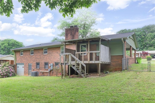 rear view of property featuring a gate, central air condition unit, brick siding, a yard, and a chimney