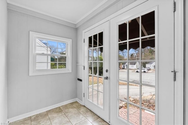 doorway to outside with crown molding and french doors