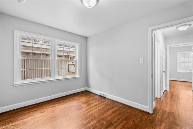 unfurnished room featuring hardwood / wood-style floors