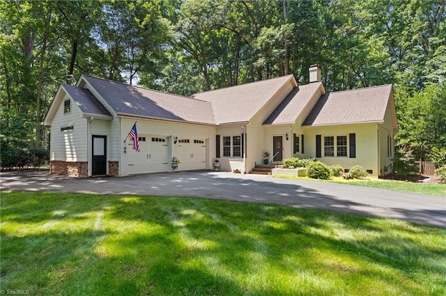 3805 Tangle Oak Dr, Clemmons, NC 27012 - view of front of house featuring driveway, a garage, a chimney, a front yard, and a shingled roof