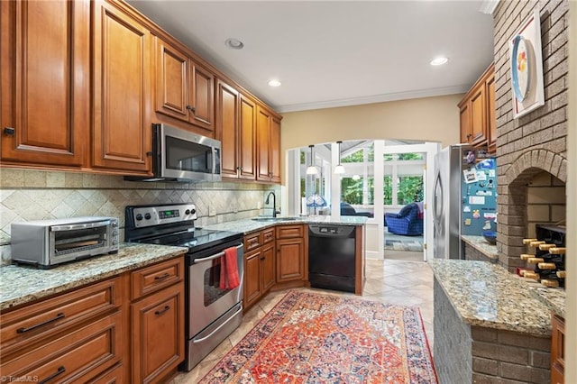 3805 Tangle Oak Dr, Clemmons, NC 27012 - kitchen featuring appliances with stainless steel finishes, backsplash, brown cabinetry, a peninsula, and ornamental molding