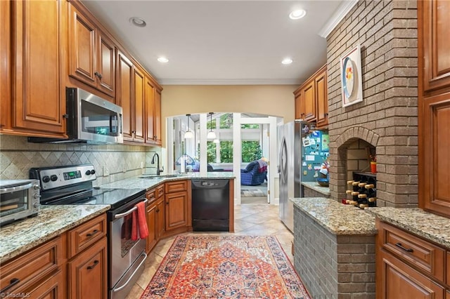 3805 Tangle Oak Dr, Clemmons, NC 27012 - kitchen with appliances with stainless steel finishes, brown cabinets, backsplash, light stone countertops, and crown molding