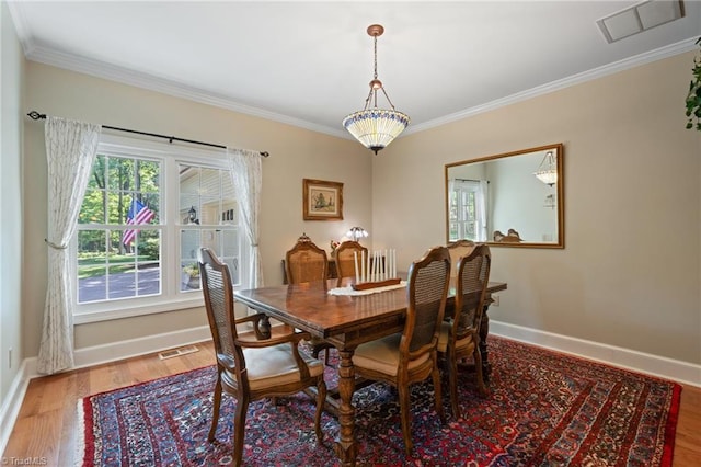 3805 Tangle Oak Dr, Clemmons, NC 27012 - dining room featuring crown molding and wood finished floors
