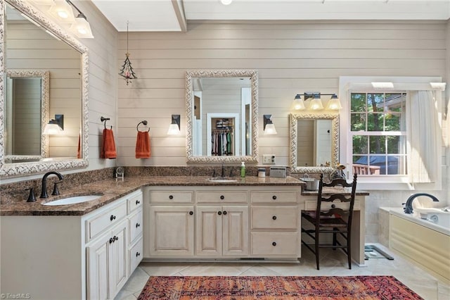 3805 Tangle Oak Dr, Clemmons, NC 27012 - full bathroom with tile patterned floors, double vanity, a garden tub, and wooden walls