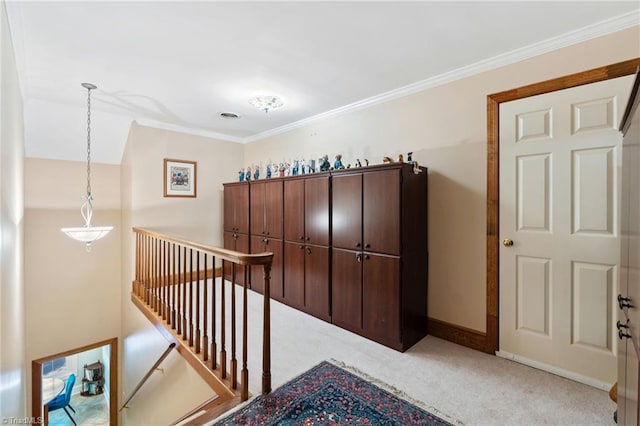 3805 Tangle Oak Dr, Clemmons, NC 27012 - hallway featuring an upstairs landing, carpet floors, and crown molding