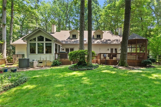 3805 Tangle Oak Dr, Clemmons, NC 27012 - back of house featuring a chimney, a deck, and a lawn