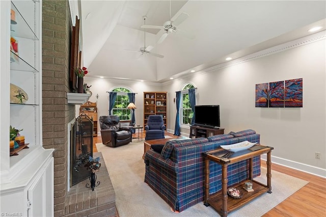 3805 Tangle Oak Dr, Clemmons, NC 27012 - living area with a brick fireplace, ceiling fan, recessed lighting, wood finished floors, and crown molding