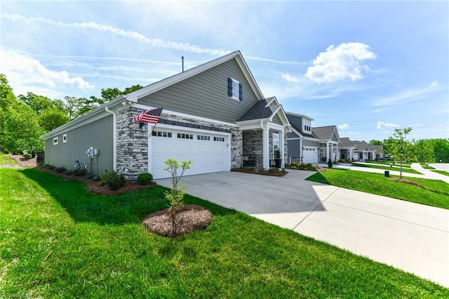 view of side of property with a lawn, driveway, and stone siding