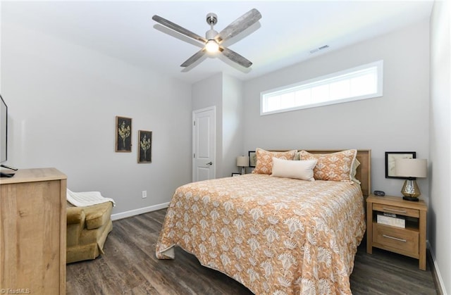 bedroom featuring visible vents, a ceiling fan, baseboards, and dark wood-type flooring