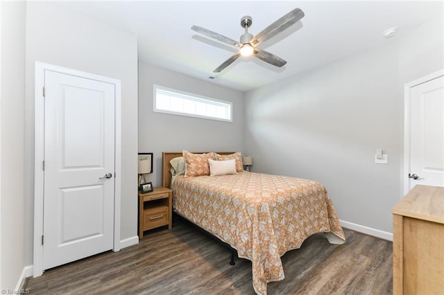 bedroom with baseboards, dark wood finished floors, and ceiling fan