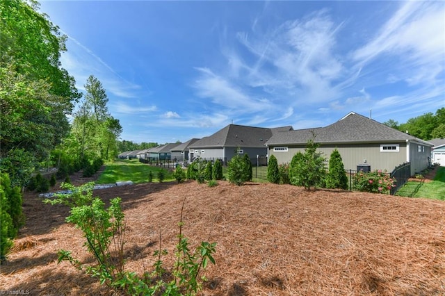 view of property exterior with fence