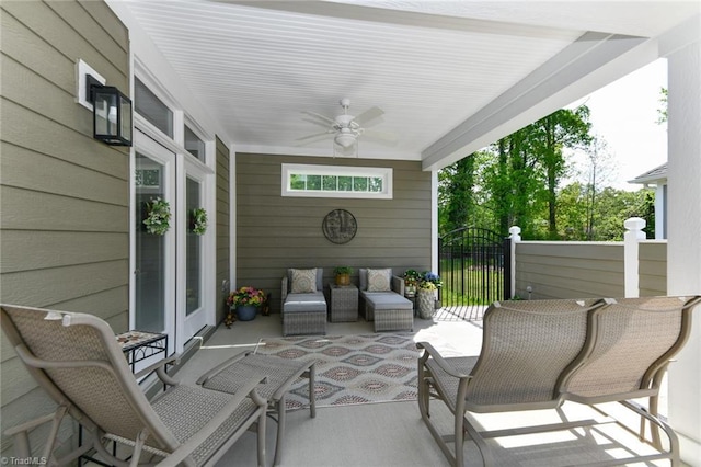view of patio with ceiling fan and an outdoor living space
