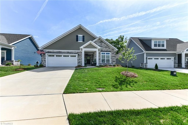 craftsman house featuring an attached garage, a front yard, driveway, and stone siding