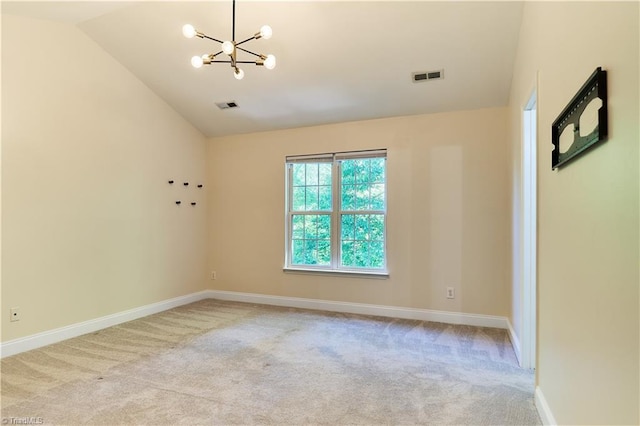 unfurnished room featuring carpet floors, a notable chandelier, visible vents, and vaulted ceiling
