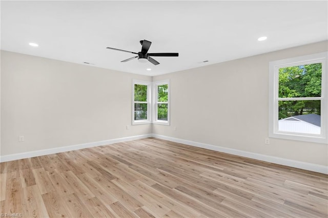 3630 Old Vineyard Rd, Winston-Salem, NC 27104 - empty room with healthy amount of natural light, baseboards, light wood-style flooring, a ceiling fan, and recessed lighting